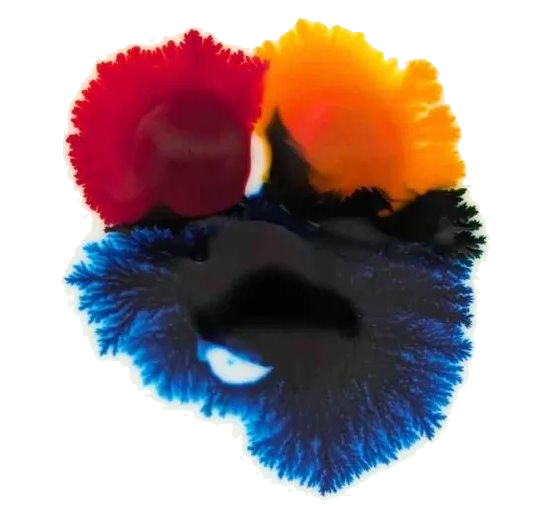 red, yellow, and blue dyes mixing into a color-wheel pattern