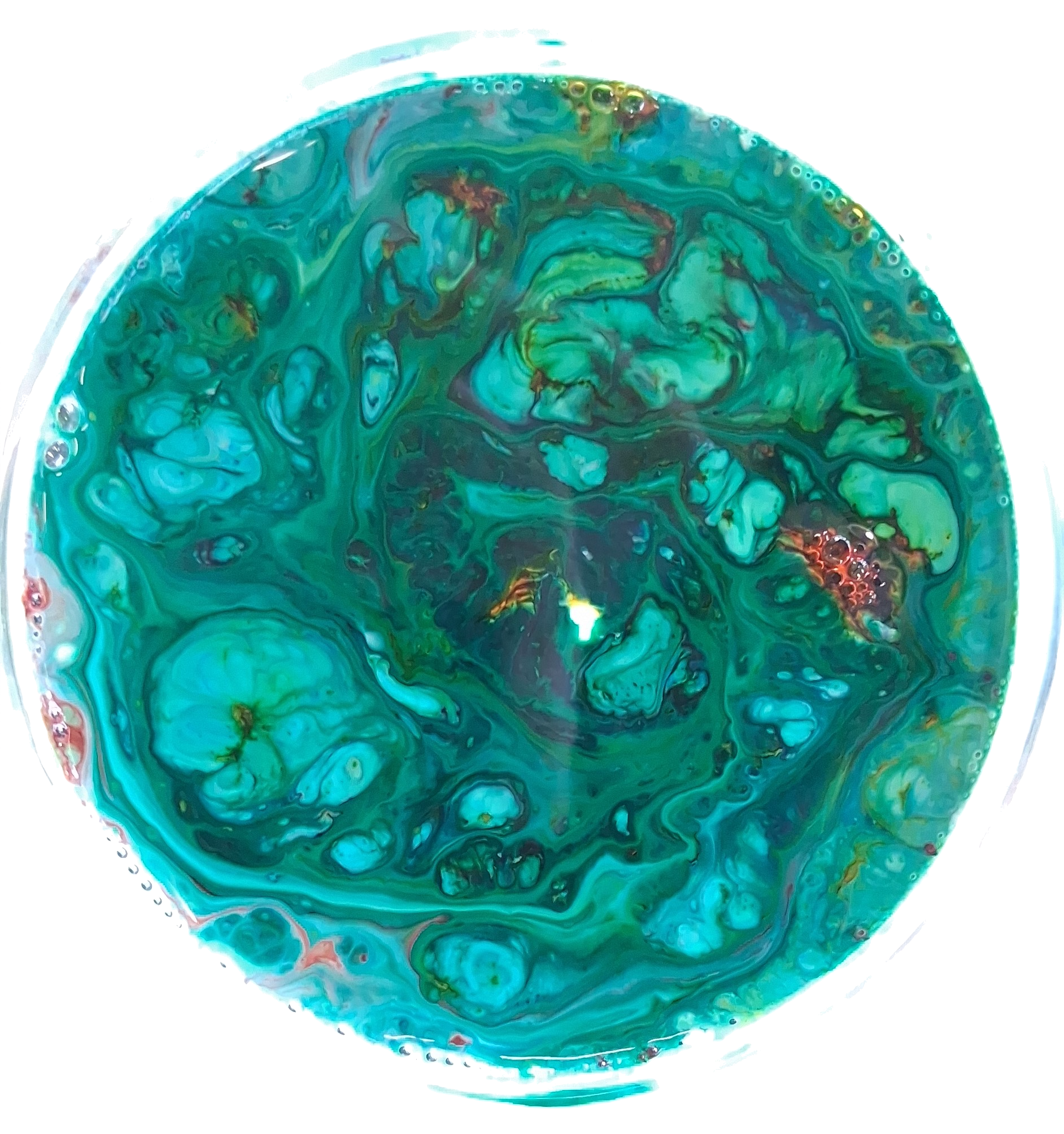 a circular image of several fluids making a paisley like pattern